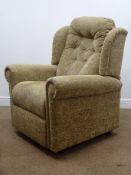 Electric riser reclining armchair, upholstered in a dark beige floral fabric,