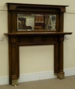 Edwardian oak fire-surround, raised bevel edge mirror back,