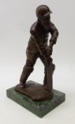 Bronze figure of W G Grace, playing a forward defensive cricket shot on rectangular marble plinth,