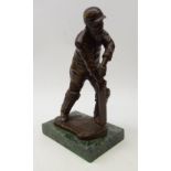 Bronze figure of W G Grace, playing a forward defensive cricket shot on rectangular marble plinth,