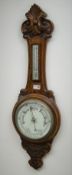 20th century oak aneroid barometer with thermometer, scroll carved case with chrome bezel,