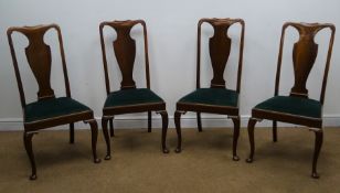 Set of four Queen Ann Style walnut dining chairs, shaped cresting rail and splat, upholstered seat,