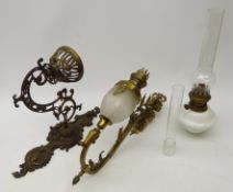 Cast brass wall mounting oil lamp, openwork cast bracket with milk glass oil lamp and chimney,