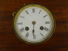 Edwardian French brass cased desk clock with circular Roman dial and visible escapement,