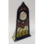 Moorcroft 'Dames Pansy' pattern mantle clock,