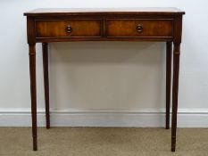Reproduction mahogany concave side table, two drawers, turned tapering reeded supports, W85cm,