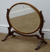 George III style inlaid mahogany oval swing table bevel edge mirror, W52cm,