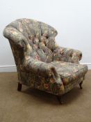 Victorian style upholstered fan back armchair, upholstered with a deep buttoned floral fabric,