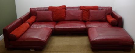 Large corner sofa group upholstered in red leather with footstool,