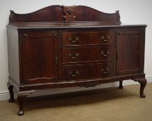 Early 20th century Georgian style mahogany serpentine front sideboard, raised shaped back,