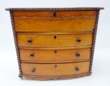 Miniature Mahogany bow front chest of drawers, four long drawers, carved borders and shaped apron,