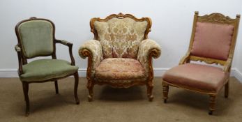 Victorian style beech framed armchair, carved scrolling frame, upholstered in a floral fabric,