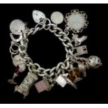 Silver charm bracelet including money box and clock,