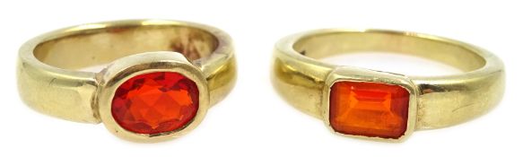 Two 9ct gold fire opal bezel set rings,
