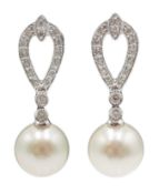 Pair of 18ct white gold diamond and pearl pendant earrings,