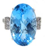 Large 18ct white gold (tested) oval Swiss blue topaz and diamond cocktail ring,