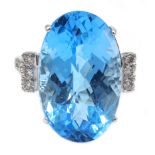 Large 18ct white gold (tested) oval Swiss blue topaz and diamond cocktail ring,