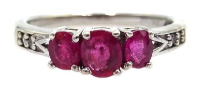 9ct white gold three stone ruby ring, with diamond shoulders,