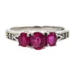 9ct white gold three stone ruby ring, with diamond shoulders,