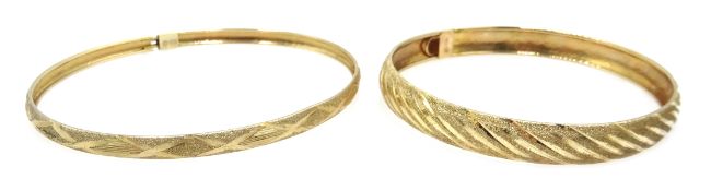 Two gold bangles, stamped 10K, approx 7.