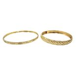 Two gold bangles, stamped 10K, approx 7.