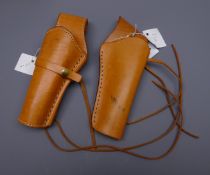 Mexican stitched brown leather cross draw holster and another similar left hand holster,