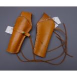 Mexican stitched brown leather cross draw holster and another similar left hand holster,