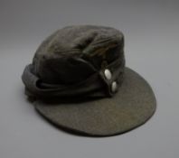 WW2 German Luftwaffe M-43 field cap, blue wool with one piece eagle and cockade insignia,