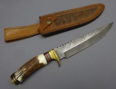 Bowie knife, 19.5cm Damascus decorated saw back blade with shaped stag horn handle, L32.