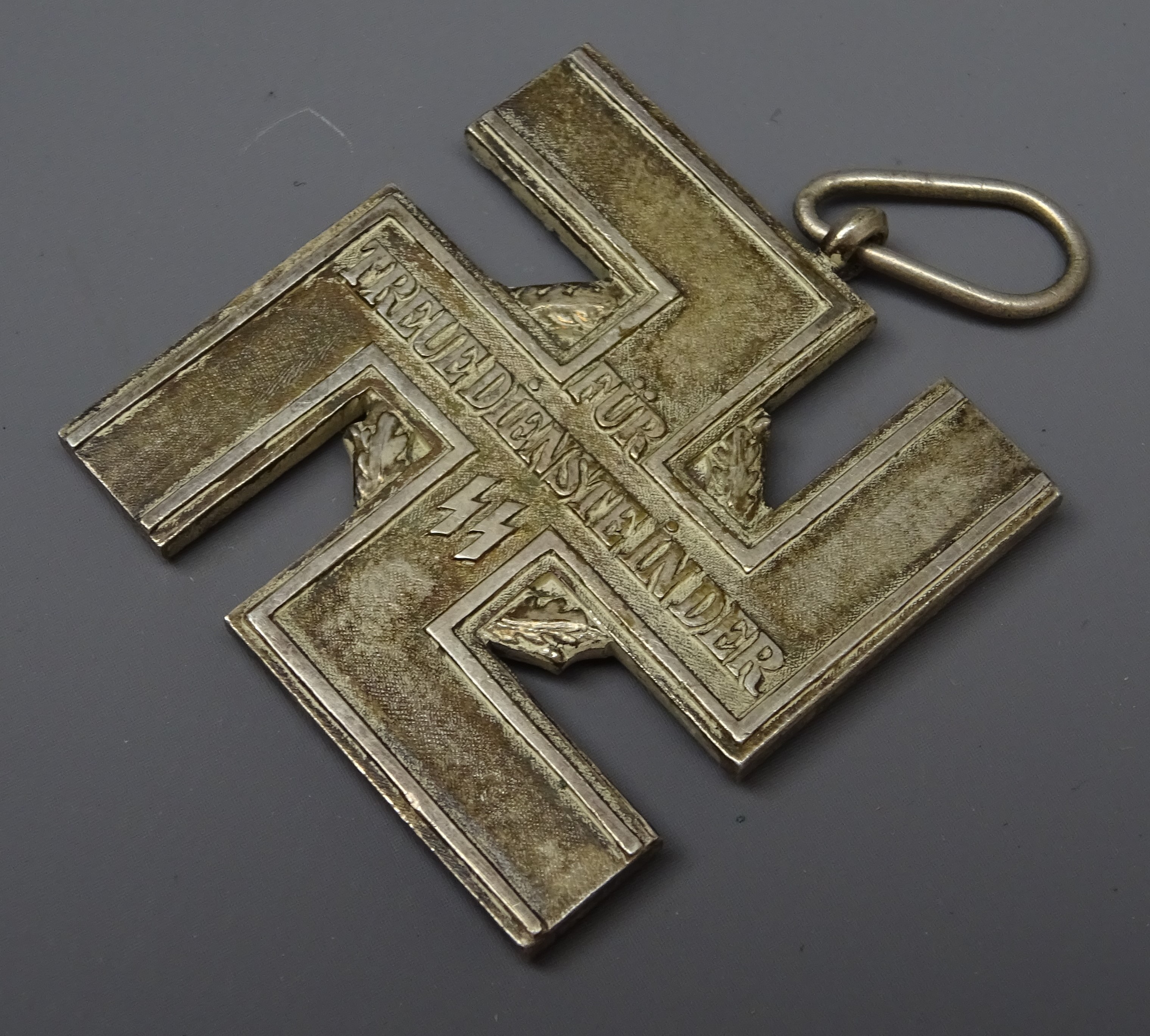 WW2 German SS 12 year Long Service Award as a silvered cross in the form of a Swastika bearing SS - Image 2 of 3