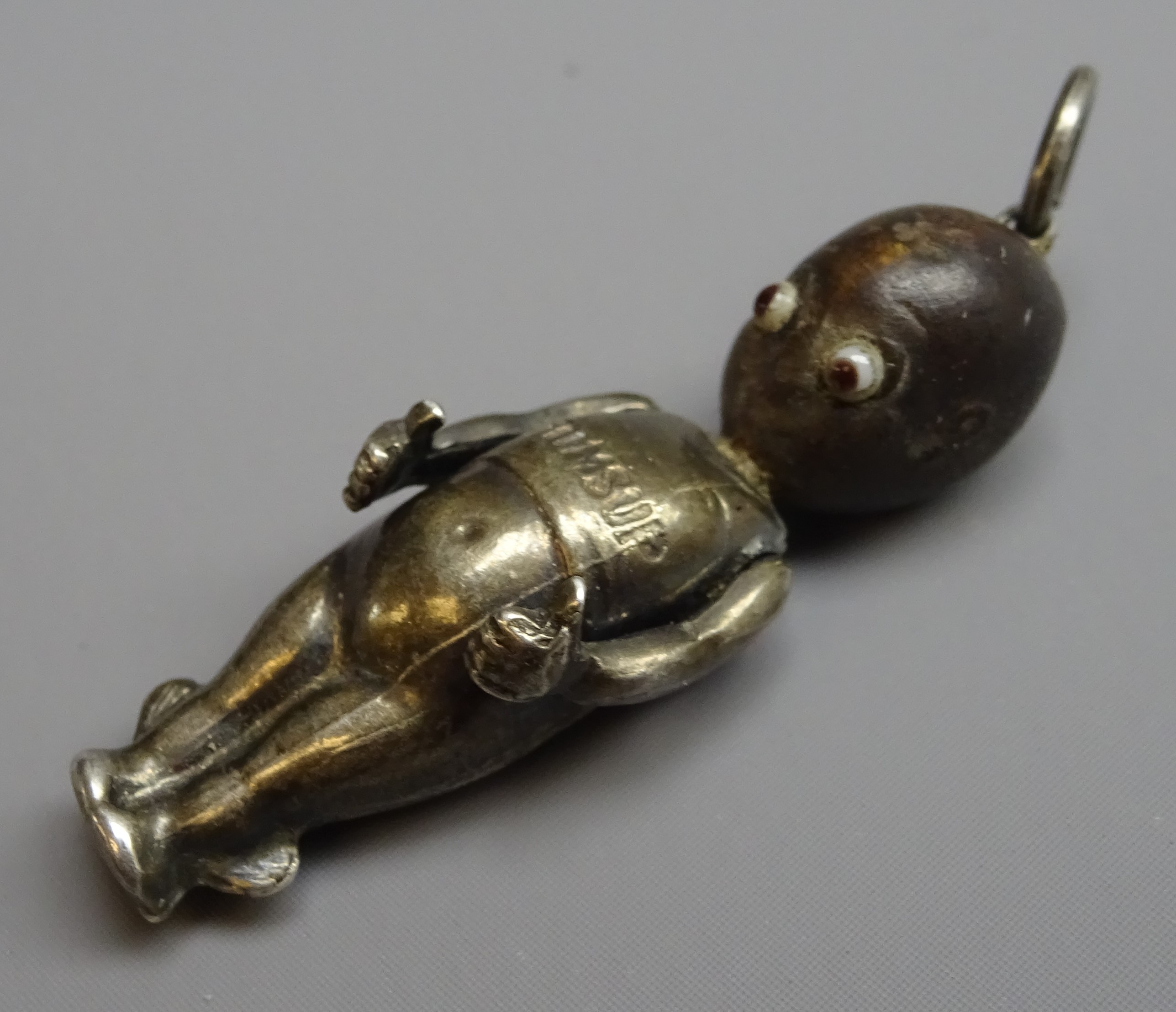 WW1 'Fumsup' good luck charm, silver body, wooden head and glass eyes, - Image 2 of 7