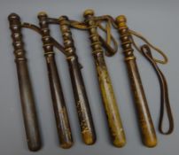 Five City of London Police turned hardwood Truncheons, some indistinctly stamped,