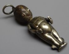 WW1 'Fumsup' good luck charm, silver body, wooden head and glass eyes,