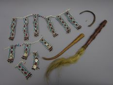 Two African waist or neck ornaments,