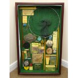 Framed fishing diorama displaying replica Hardy Bros oil bottle, lures, printed book covers, reel,