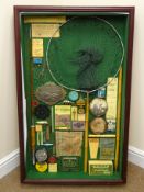 Framed fishing diorama displaying replica Hardy Bros oil bottle, lures, printed book covers, reel,