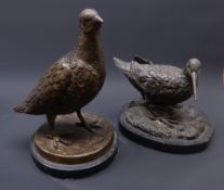 Patinated bronze model of a Sandpiper and Partridge on black marble bases,