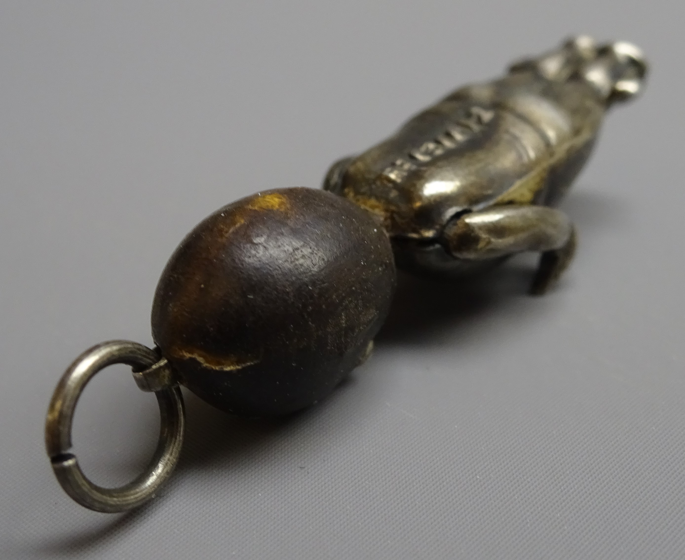 WW1 'Fumsup' good luck charm, silver body, wooden head and glass eyes, - Image 7 of 7