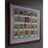 Framed display of twenty-four Army cloth badges including various signal regiments, squadrons,