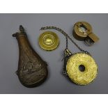 Victorian brass powder flask embossed with battle trophies H22cm,