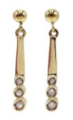 Pair of 9ct gold three stone diamond pendant earrings,
