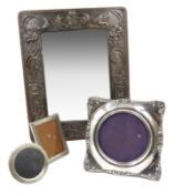 Three silver mounted photograph frames and a mirror Condition Report <a