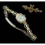 Gold and seed pearl harp bar brooch and a 9ct gold Rotary wristwatch on plated bracelet