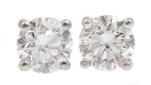 Pair of 18ct white gold diamond stud earrings, stamped 750,