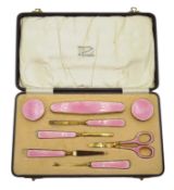 Art Deco silver gilt and pink guilloche enamel manicure set by Adie Brothers Ltd,
