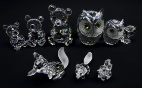 Nine Swarovski Crystal figures: Three graduated Bears, Owls and Foxes,
