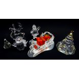 Five Swarovski Crystal Christmas figures comprising Santa Claus, Sleigh, on mirrored stand,