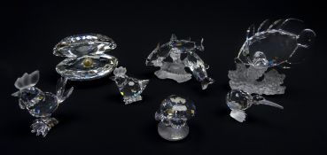 Seven Swarovski crystal figures: Three South Sea Fish, Butterfly Fish on Coral, Oyster & Pearl,