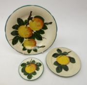 Matched graduated set of Wemyss plates decorated with Oranges, all with painted marks, D20.