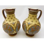 Pair Mettlach stoneware baluster form jugs,